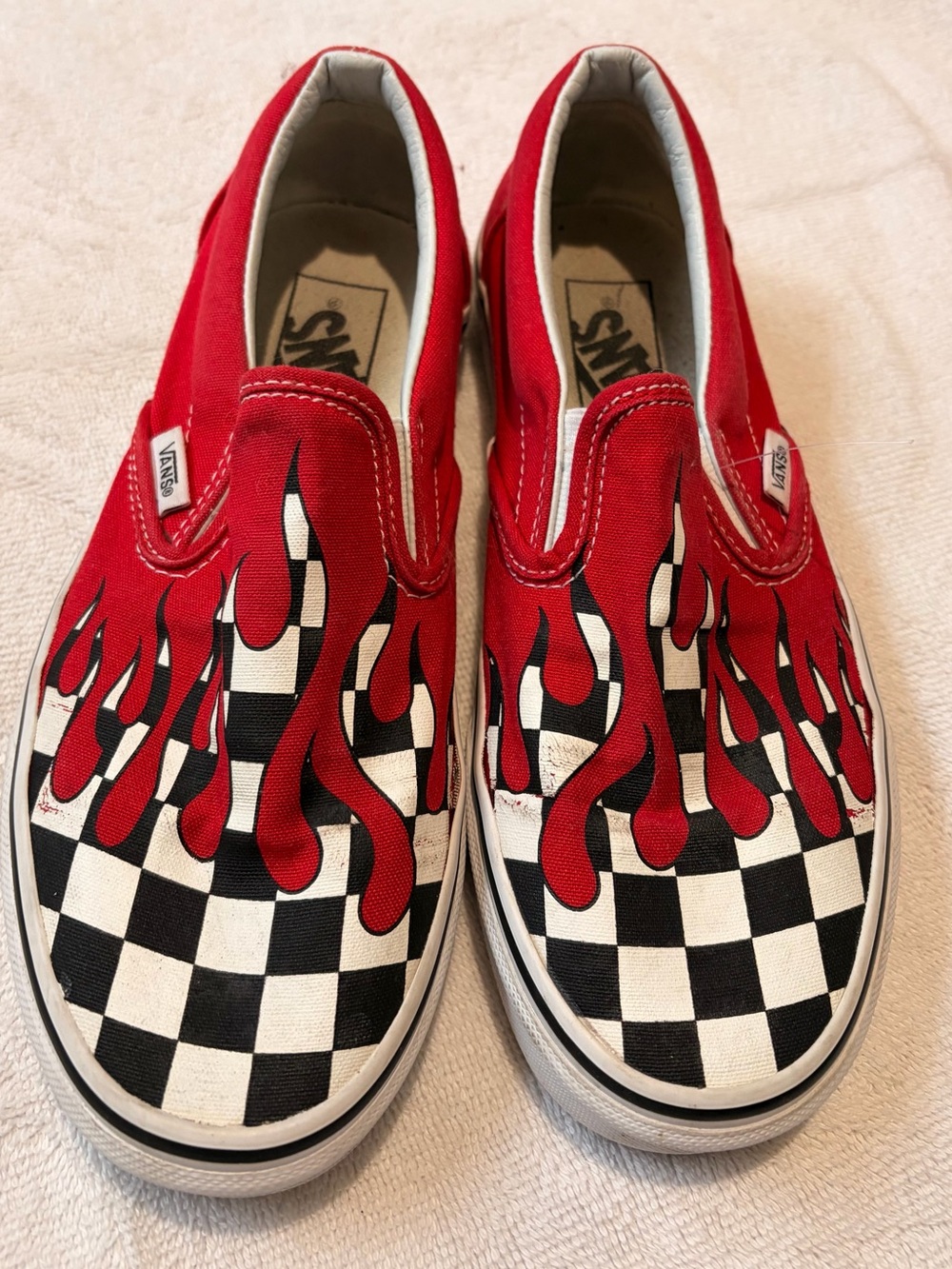 Vans Men’s Red Slip-On Sneakers with Checkerboard and Flame Motif